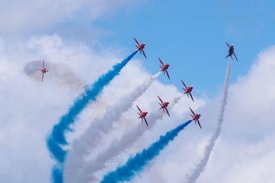 Low angle view of airshow in sky