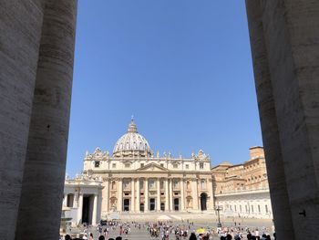 People by st peter basilica against sky