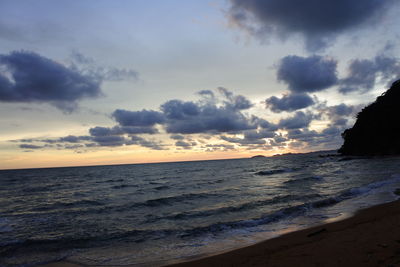 Scenic view of beach against sky during sunset