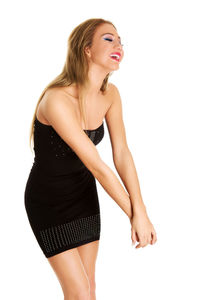 Young woman looking away against white background