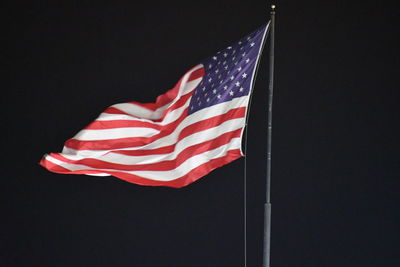 Low angle view of flag against the sky