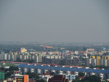 High angle view of buildings in city against clear sky