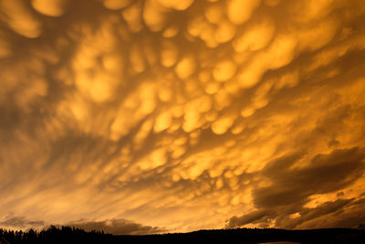 Low angle view of dramatic sky during sunset