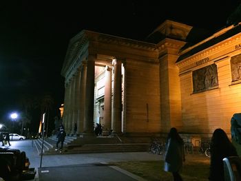 View of illuminated people at night