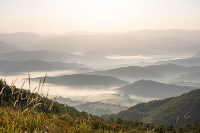 Scenic view of mountains against sky during sunset