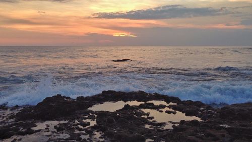 Scenic view of sea at sunset