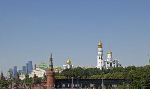 View of buildings in city against clear sky