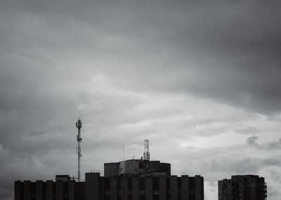 Buildings in city against sky