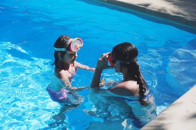 Full length of girls in swimming pool