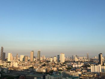 High angle view of city at sunset