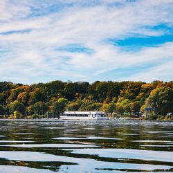 Scenic view of lake in forest against sky