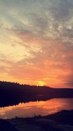 Scenic view of lake against romantic sky at sunset