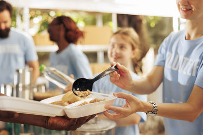 Midsection of woman preparing food