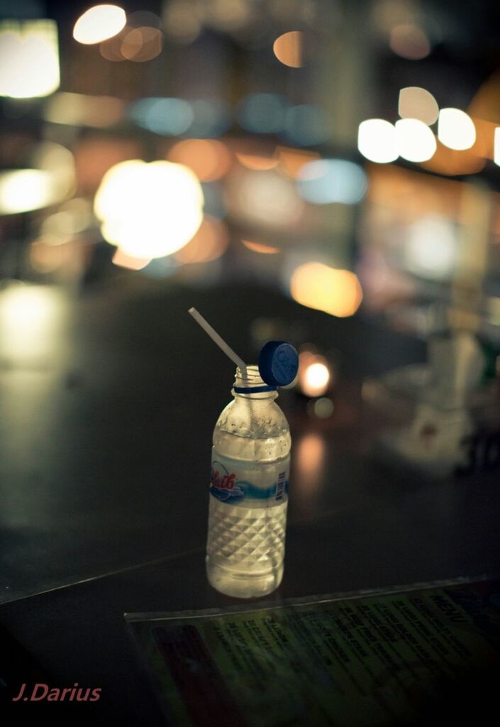 illuminated, night, focus on foreground, lighting equipment, indoors, close-up, table, text, no people, decoration, selective focus, still life, light - natural phenomenon, lens flare, glowing, candle, lit, glass - material, food and drink, communication