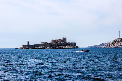 Scenic view of sea against blue sky