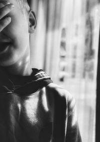 Close-up portrait of boy looking at home