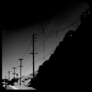 Electricity pylon against cloudy sky