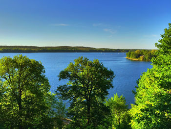 Scenic view of sea against clear blue sky