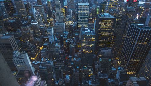 High angle view of illuminated buildings in city at night