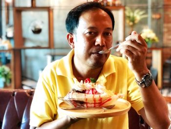 Portrait of man eating food