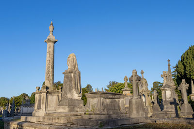 Ruins of temple against clear blue sky