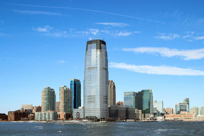 Modern buildings in city against sky