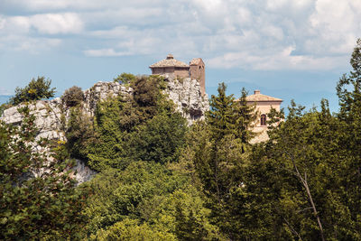 Castle on cliff against sky