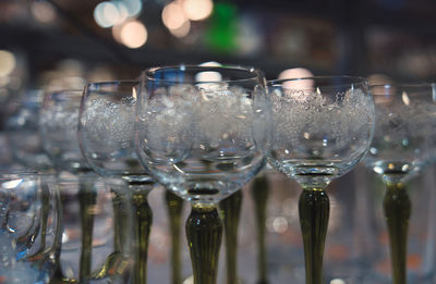 Close-up of wine glasses on table