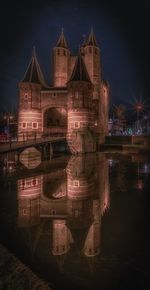 Reflection of illuminated buildings in water at night