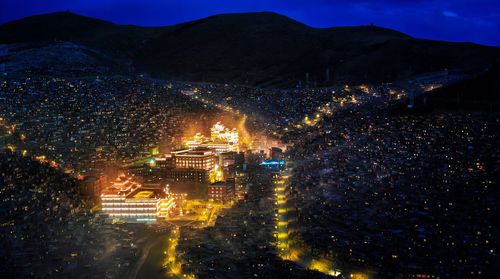 High angle view of illuminated cityscape at night
