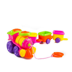 Close-up of multi colored toys against white background