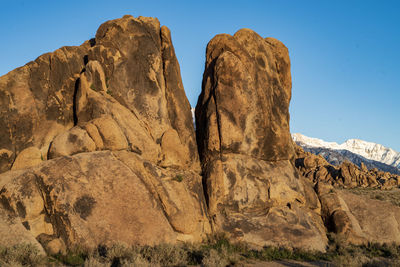 Low angle view of rock formation against clear sky