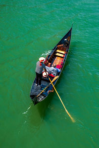 High angle view of man on boat in sea