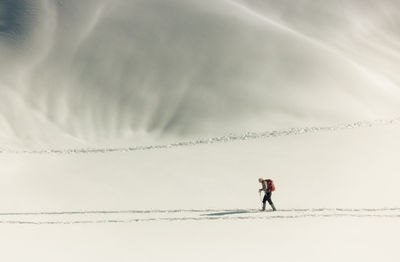 Low angle view of man walking on field