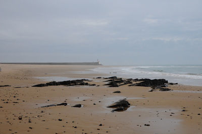 Scenic view of normandie beach against sky