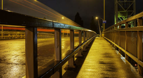 Illuminated bridge at night