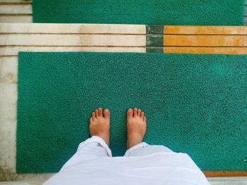 Low section of woman standing on ground