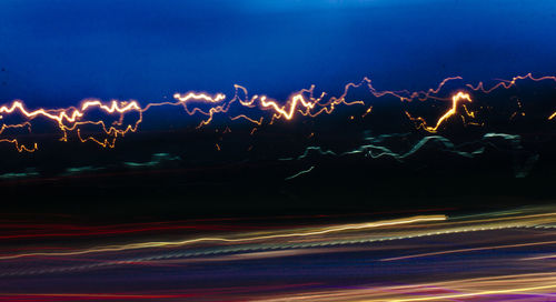 Light trails against sky at night