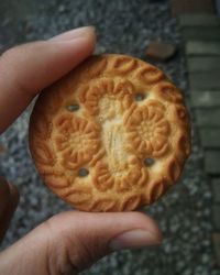 Close-up of hand holding ice cream