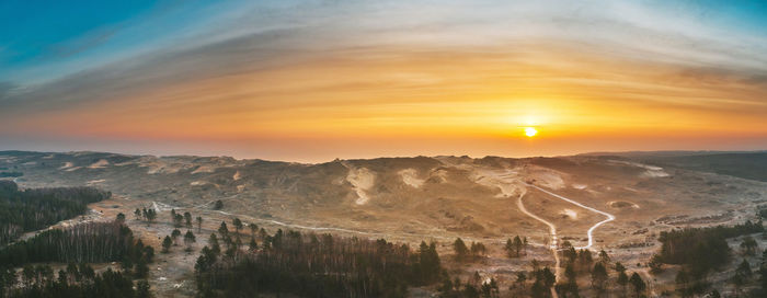 Scenic view of sunset over mountain