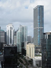 Modern buildings in city against sky