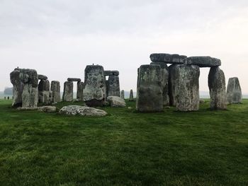 Old ruins on field against sky