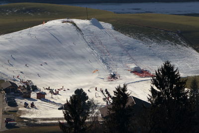 High angle view of people on snowcapped mountain