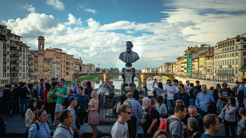 Group of people in front of buildings