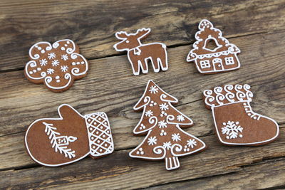 Top view of christmas gingerbread cookies on a wooden table