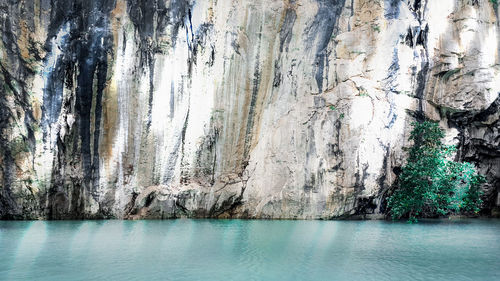 Panoramic view of rock formation in sea