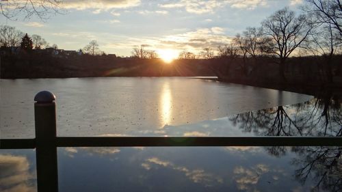View of calm lake at sunset