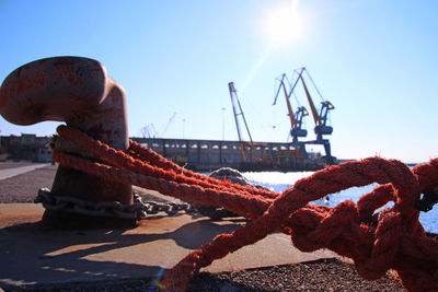 Close-up of commercial dock against clear sky