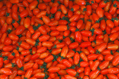 Full frame shot of tomatoes and vegetables for sale at market stall