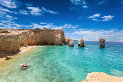 Scenic view of sea against blue sky during sunny day